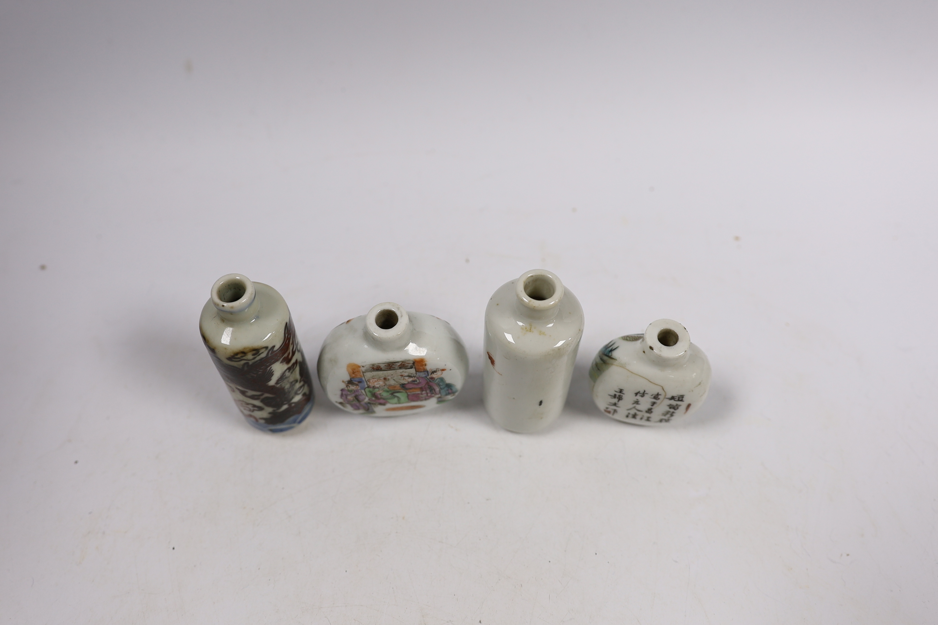 Three 19th century Chinese famille rose snuff bottles, and an underglaze copper red ‘Dragon’ snuff bottle, tallest 9cm
